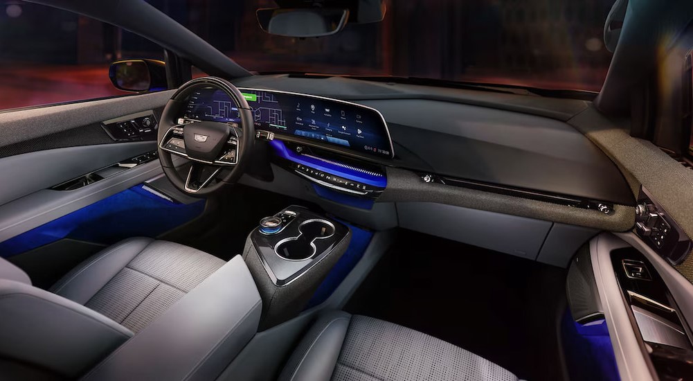 The blue and gray interior and dash in a 2025 Cadillac OPTIQ is shown.