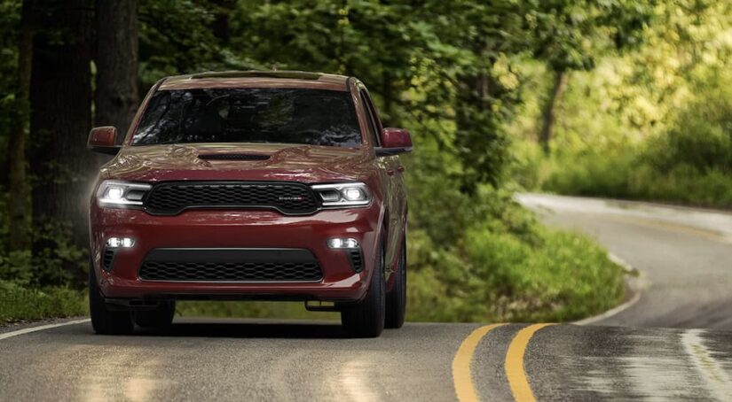 A maroon 2024 Dodge Durango is shown from the front.