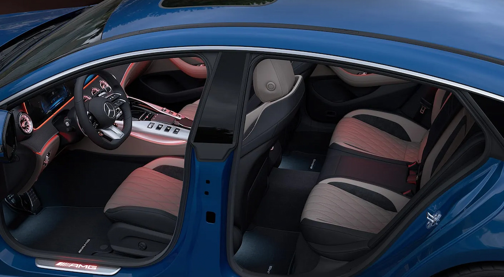 The two rows of seating in a blue 2024 Mercedes-Benz AMG GT Coupe.