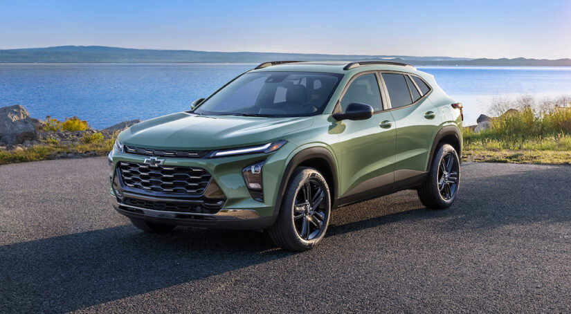 A green 2025 Chevy Trax ACTIV parked near water.