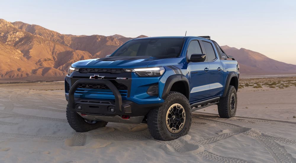 A blue 2024 Chevy Colorado ZR2 is shown from the front at an angle after leaving a Chevy dealer.