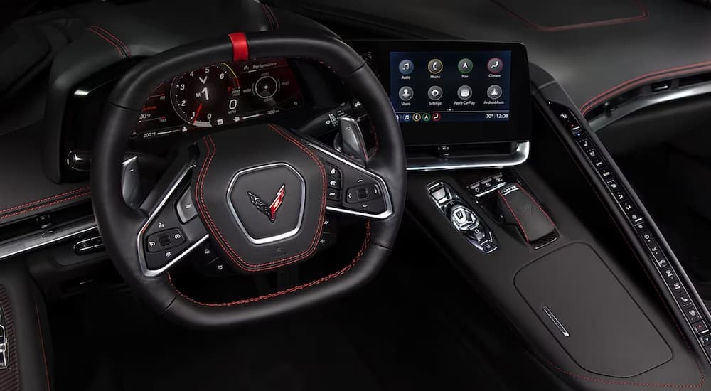 The black interior and dash in a 2025 Chevy Corvette Stingray is shown.