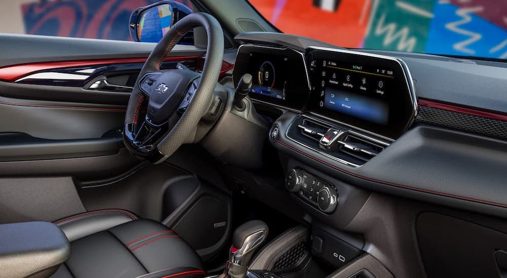 The black interior of a 2025 Chevy Trailblazer RS is shown from the passenger side.