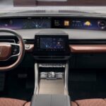 The black and brown interior and dash in a 2025 Lincoln Nautilus is shown.