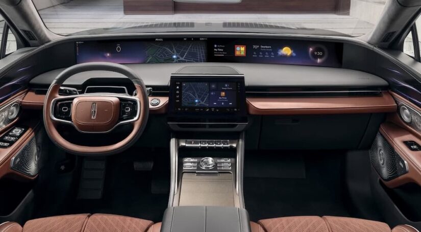 The black and brown interior and dash in a 2025 Lincoln Nautilus is shown.