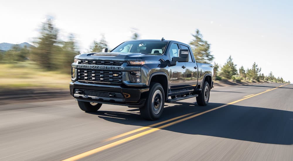 A grey 2020 used Chevy Silverado 2500 for sale is shown from the front at an angle.