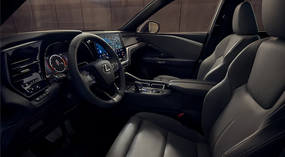 Side view of the front seats and dashboard in a 2024 Lexus TX for sale.