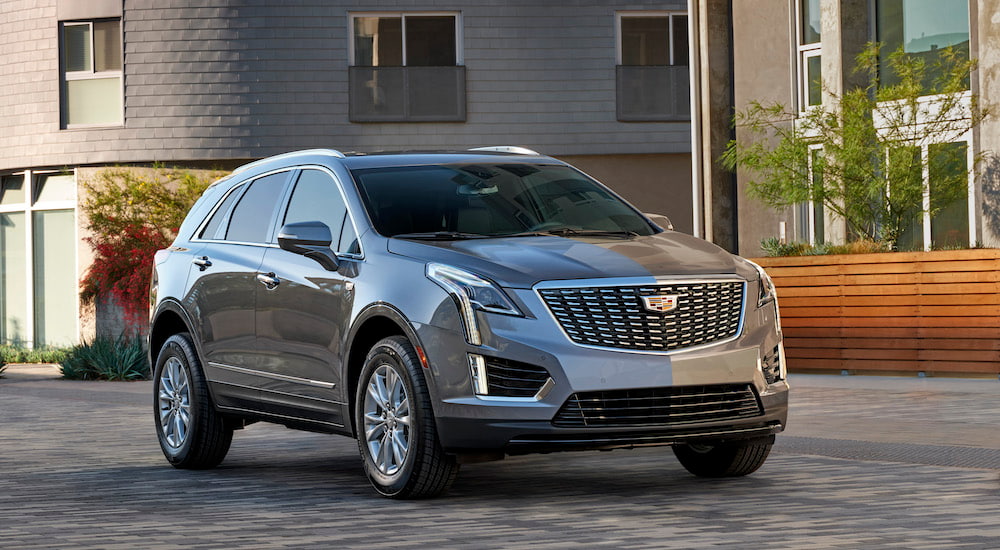 A silver 2021 Cadillac XT5 is shown from the front at an angle.