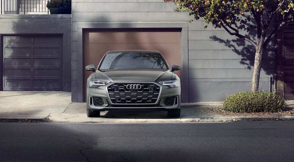 A silver 2024 Audi A6 is shown parked on a driveway.