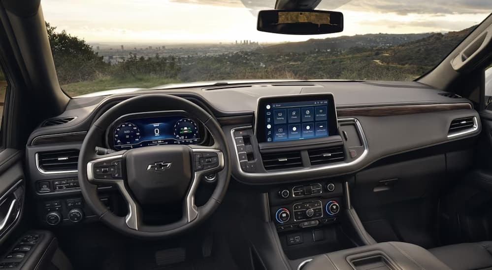 The gray interior and dash in a 2024 Chevy Tahoe is shown.