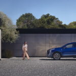A blue 2024 Cadillac XT5 for sale is shown from the side.