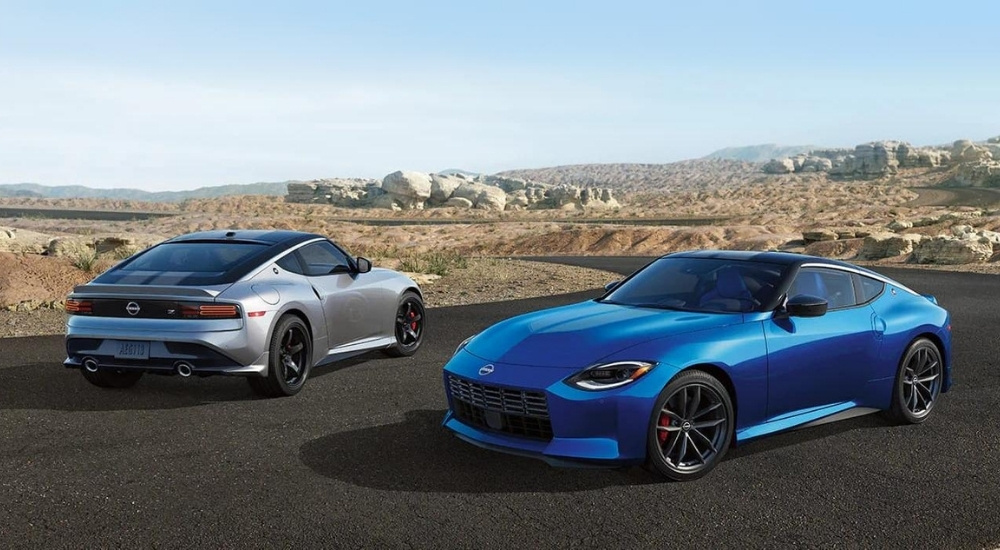 A silver and a blue 2023 Nissan Z are shown facing opposite directions.