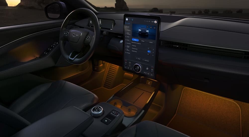 Orange ambient lighting in the cabin of a 2024 Ford Mustang Mach-E.