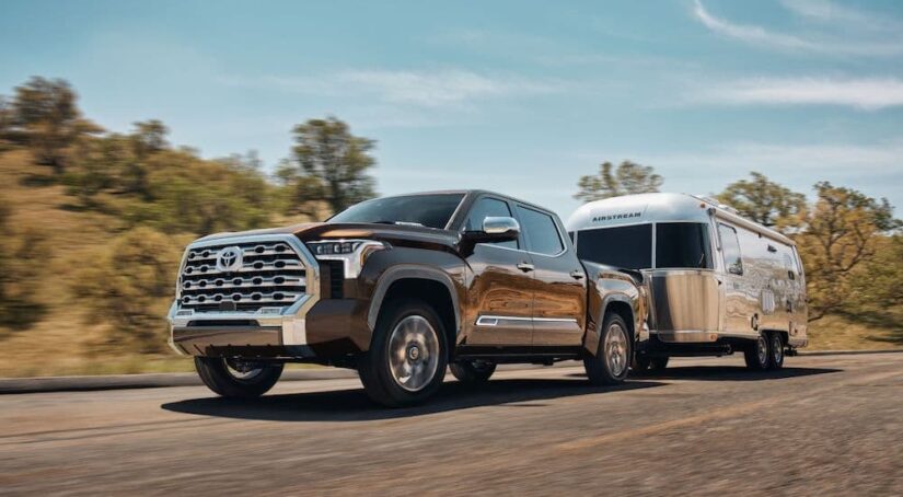 A brown 2024 Toyota Tundra 1794 Edition is shown from the front at an angle.