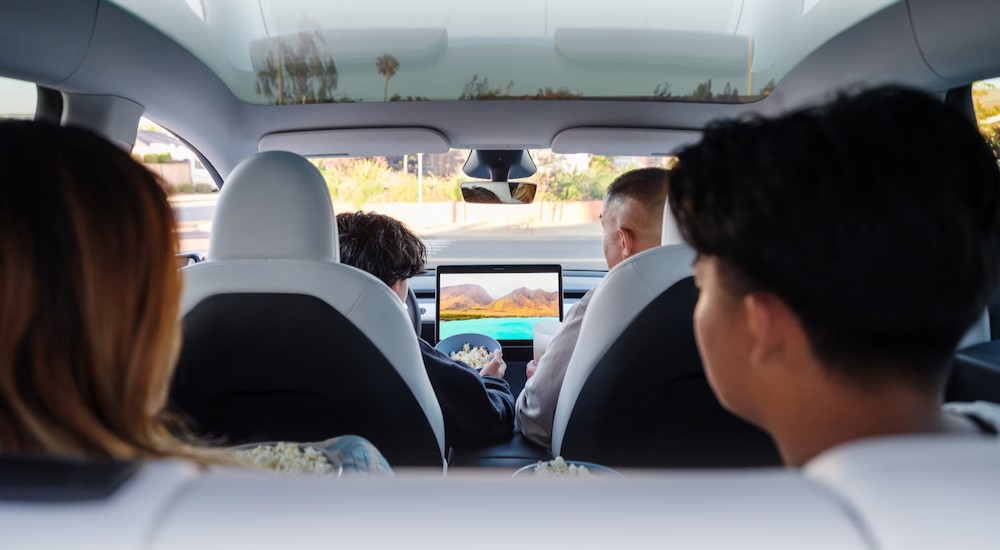 The white and black interior and dash is shown in a 2024 Tesla Model Y.