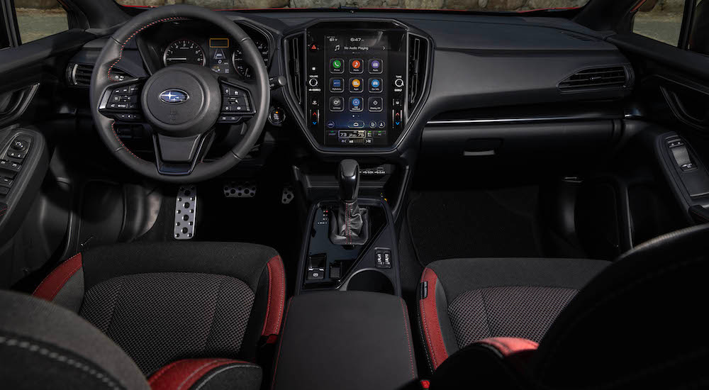 The black interior of a 2024 Subaru Impreza RS is shown from above the center console.