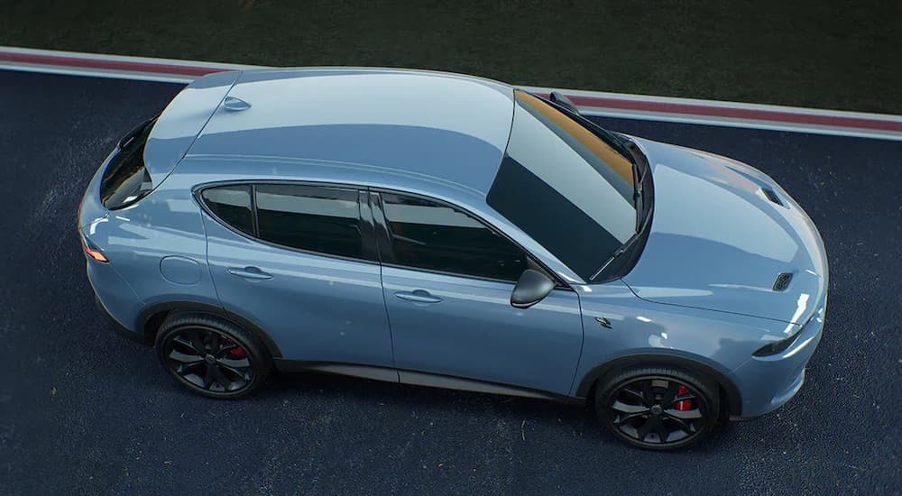 A silver 2024 Dodge Hornet is shown from the side.