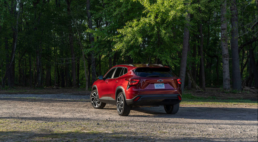 A red 2024 Chevy Trax RS is shown from the rear at an angle.