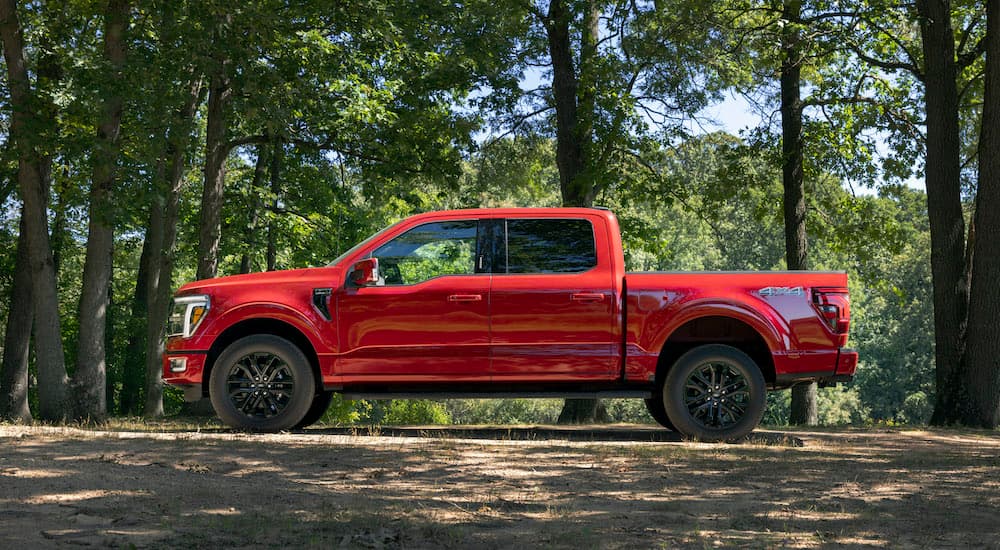 A red 2025 Ford F-150 for sale is shown from the side.