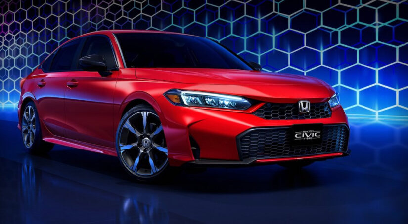 A red 2025 Honda Civic Sport Touring Hybrid is shown from the front at an angle.