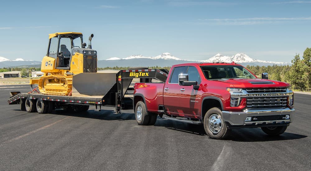 A red 2020 Chevy Silverado 3500 HD is shown from the front at an angle.