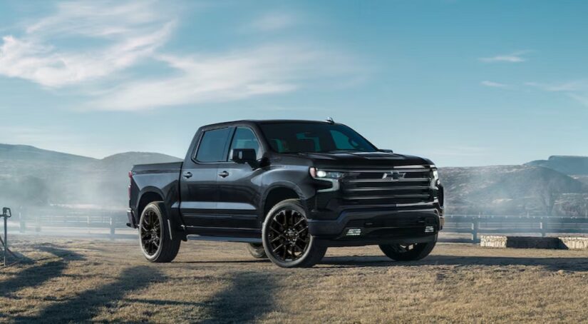 A black 2025 Chevy Silverado 1500 High Country Black Edition is shown parked after visiting a Chevy dealer near me.