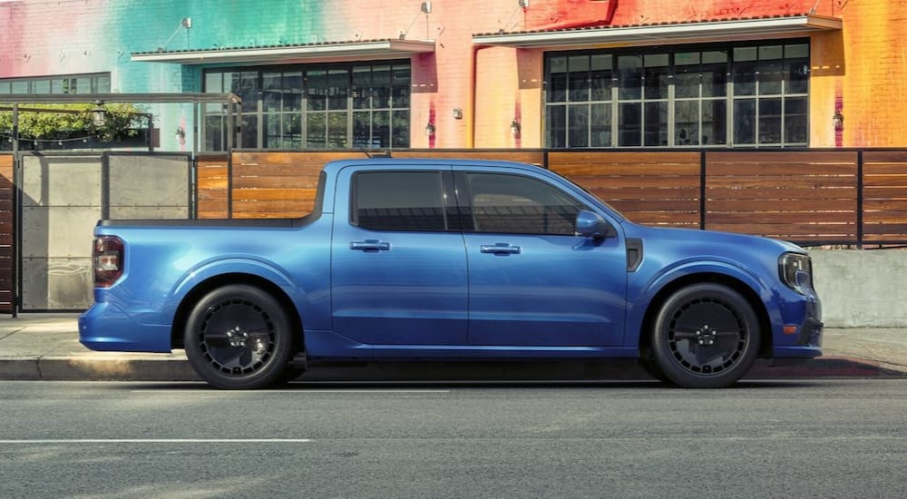 A blue 2025 Ford Maverick is shown parked.