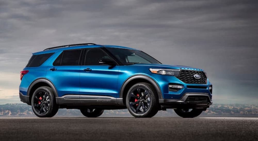 A blue 2020 Ford Explorer ST parked in the mountains.