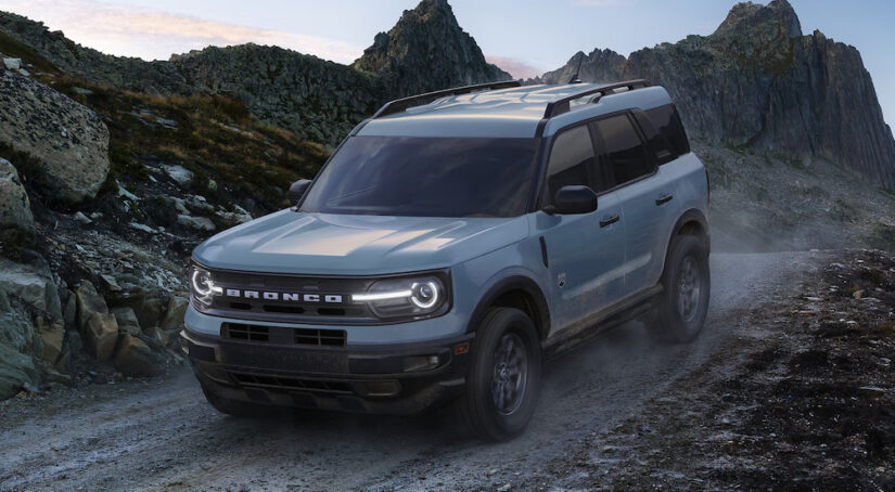 A grey 2023 Ford Bronco Sport Big Bend driving off-road down a hill.