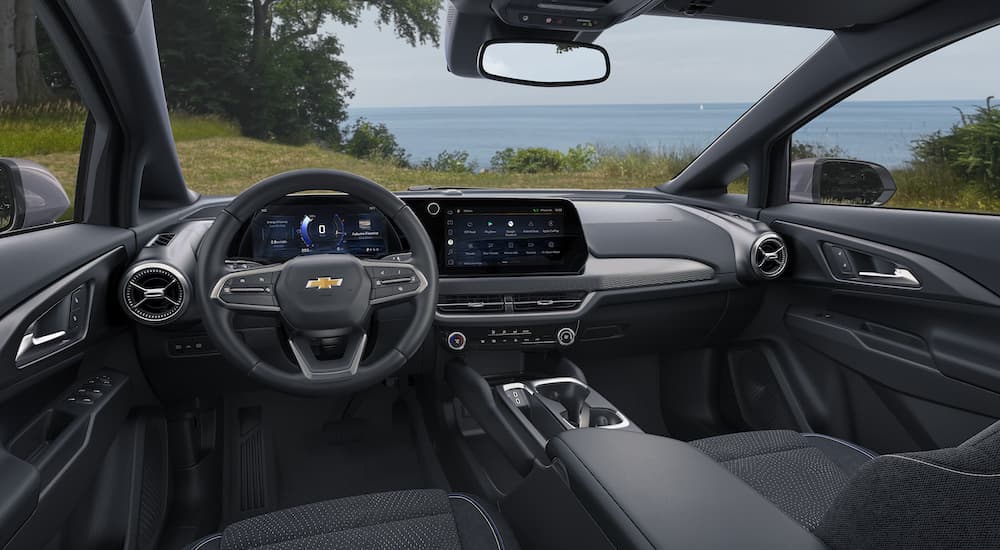 The interior of a 2025 Chevy Equinox EV for sale is shown from the driver's seat.