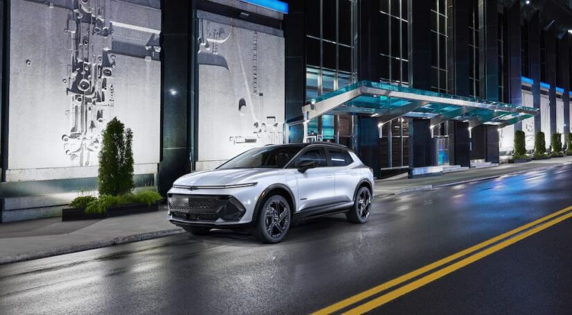 A white 2025 Chevy Equinox EV 3RS is shown from the front at an angle.