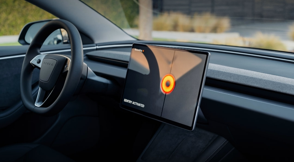 The infotainment screen in a 2024 Tesla Model 3 showing that Sentry Mode is activated.