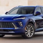 A blue 2025 Buick Envision Avenir is shown parked after viewing a Buick Envision for sale.