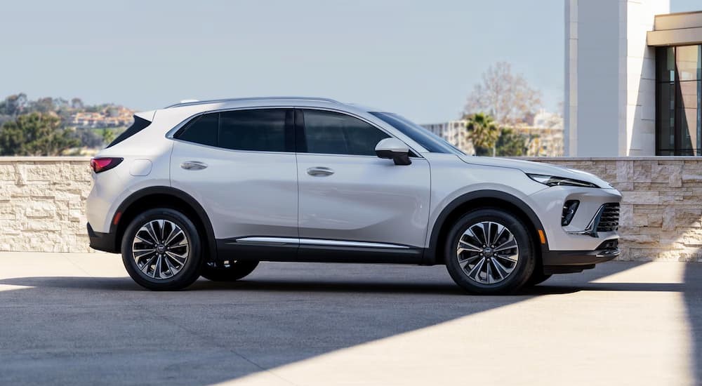 A white 2025 Buick Envision GX is shown parked outdoors.