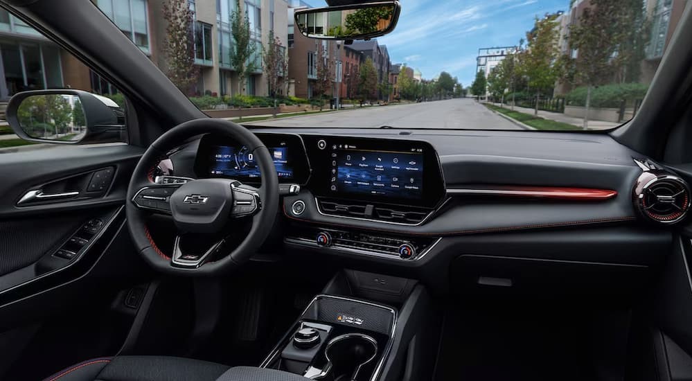 The black interior and dash are shown in a 2025 Chevy Equinox.