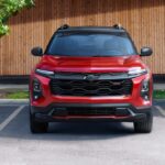 A red 2025 Chevy Equinox RS is shown parked after viewing a Chevy Equinox for sale.