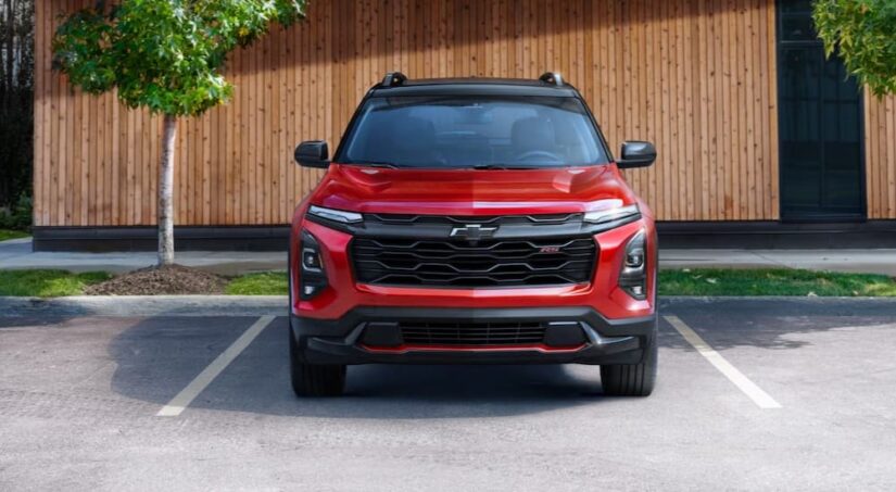 A red 2025 Chevy Equinox RS is shown parked after viewing a Chevy Equinox for sale.