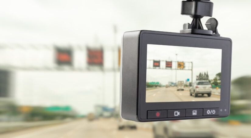 Close-up of a dashcam recording highway traffic.