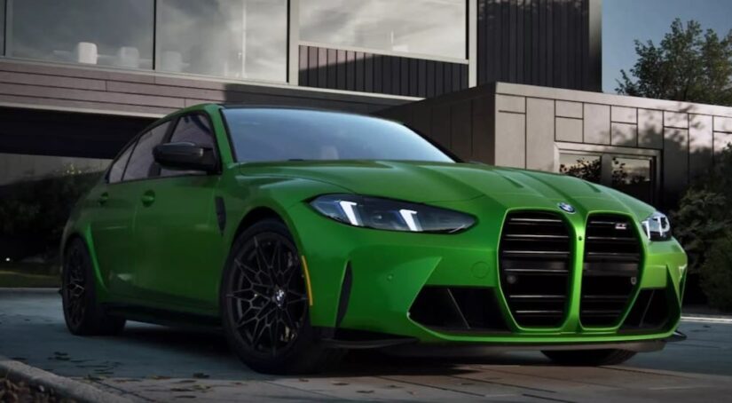 A green 2025 BMW M3 for sale is shown parked on a driveway.