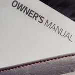 An owner's manual is shown.