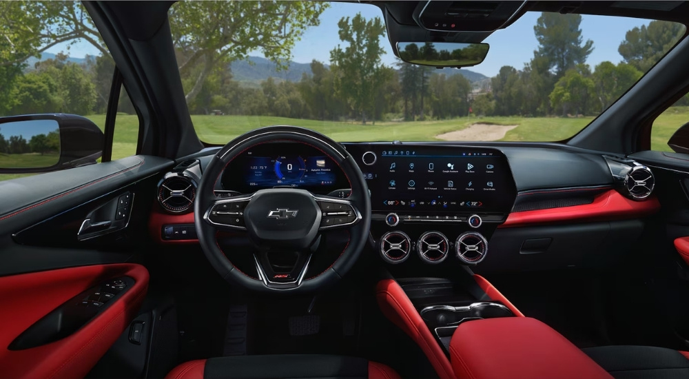 The red and black interior of a 2025 Chevy Blazer EV RS.