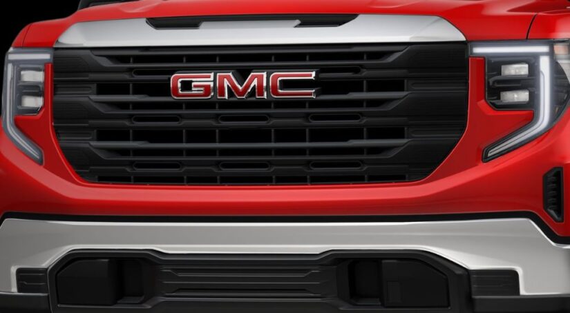 Close-up of the grille on a red 2025 GMC Sierra Pro.