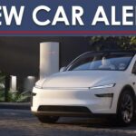 A New Car Alert banner is shown above a white 2025 Tesla Model Y.