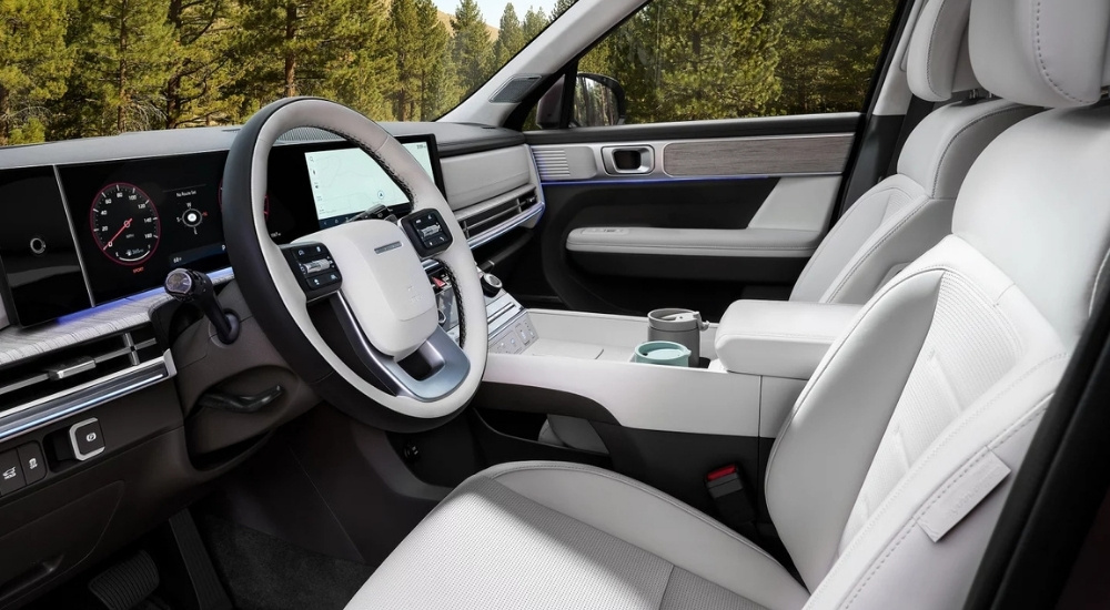 The black and white interior is shown in a 2025 Hyundai Santa Fe.