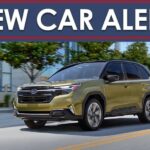 A green 2025 Subaru Forester Hybrid is shown driving on a city street.