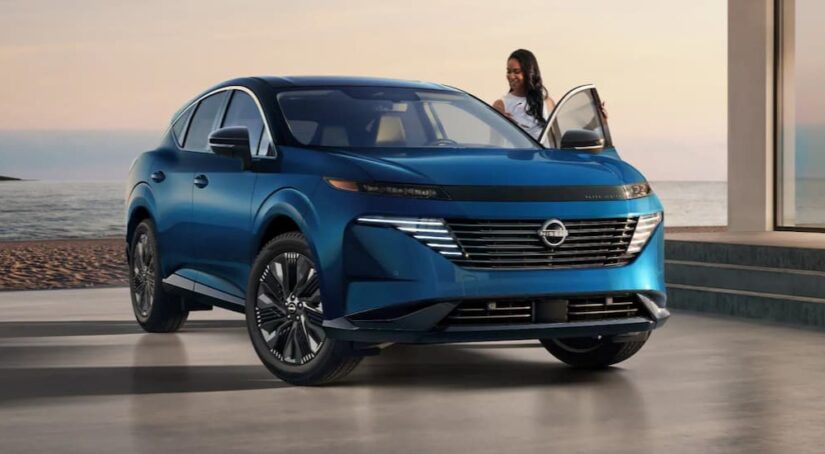 A person is shown entering a blue 2025 Nissan Murano Platinum.