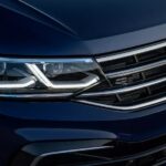 The grille of a blue 2024 Volkswagen Tiguan R-Line.