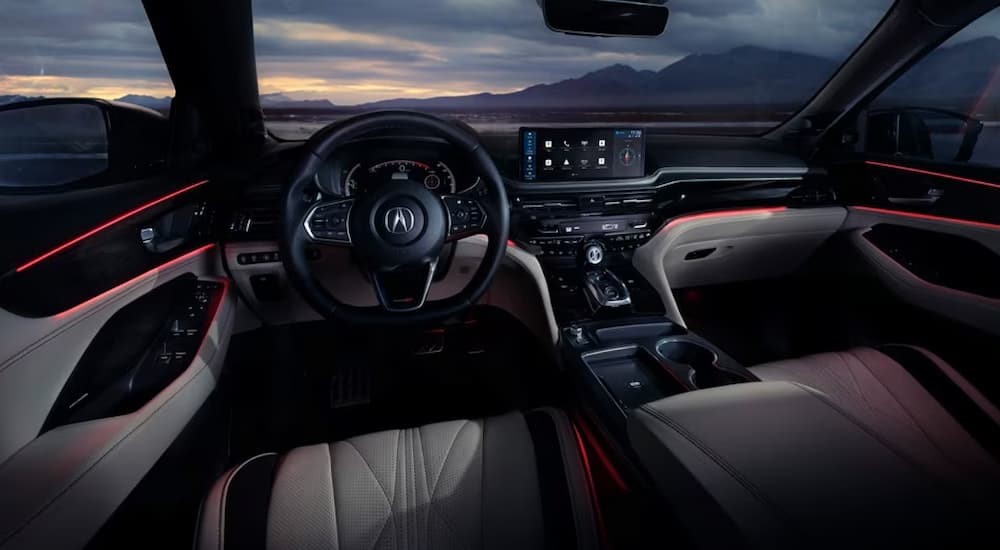 The black and gray interior and dash are shown in a 2025 Acura MDX.