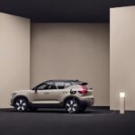 A tan 2025 Volvo EX40 parked and charging.
