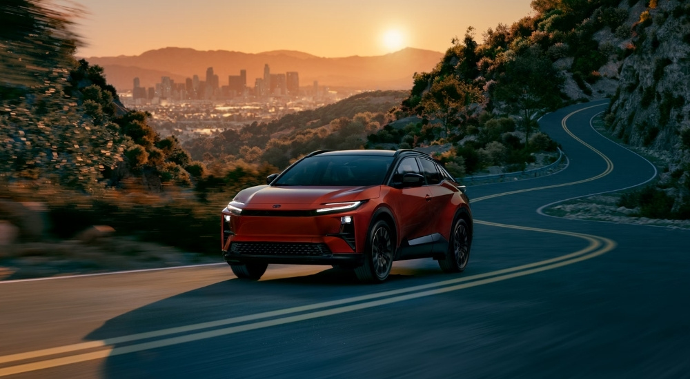 An orange 2026 Toyota C-HR from the front.